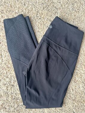 High-Waist Black Lululemon Athletic Leggings with mesh side panels